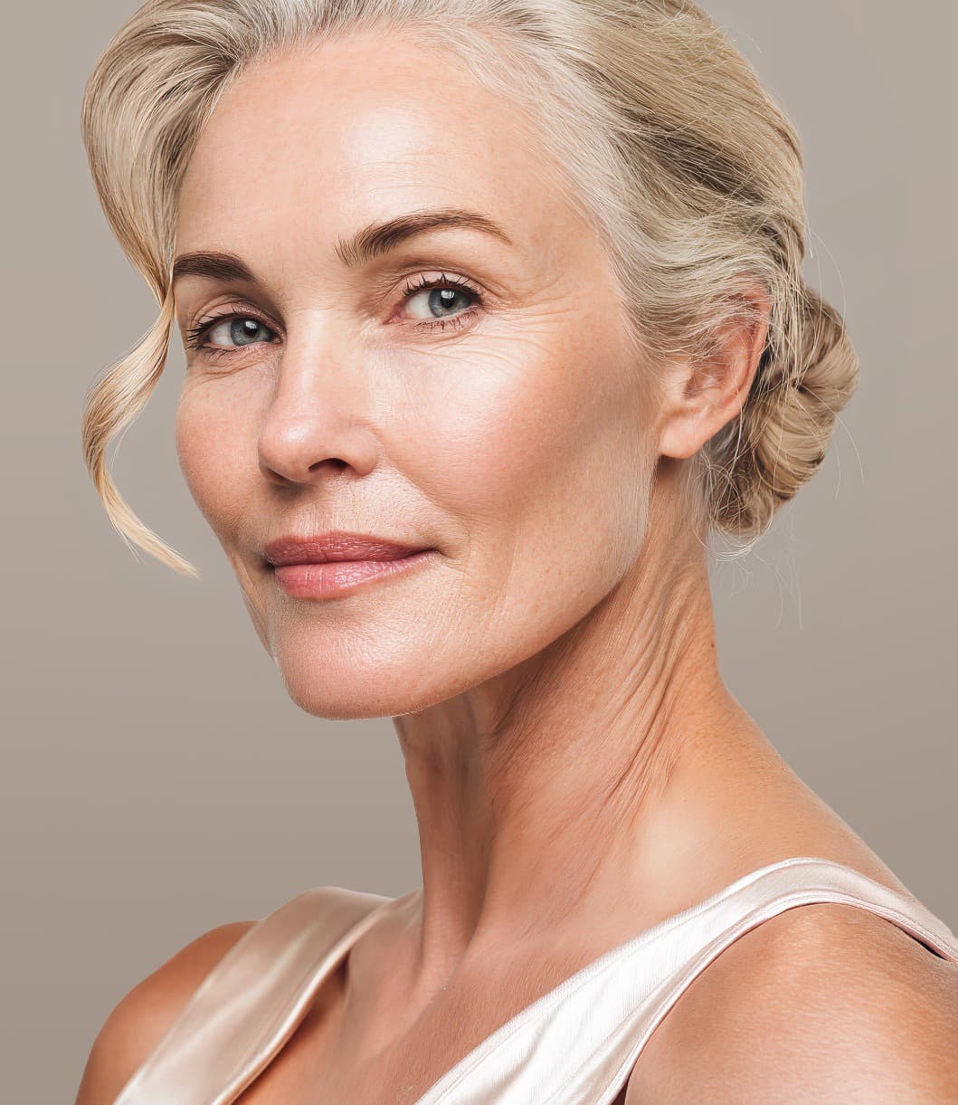 Woman with a smooth, lifted jawline after a deep plane facelift