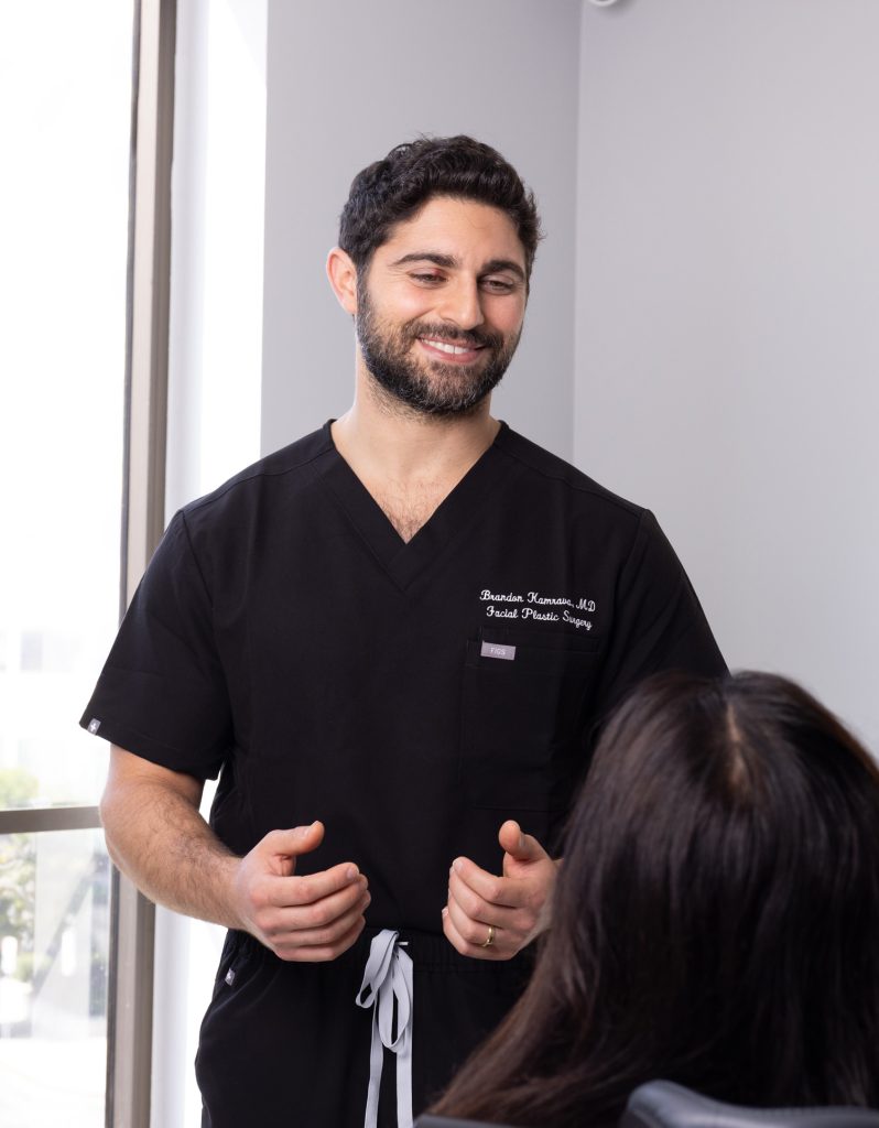 Dr. Brandon Kamrava talking to a patient